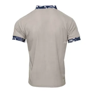 Detailed back view of men's grey corduroy short sleeve shirt with navy paisley trim.