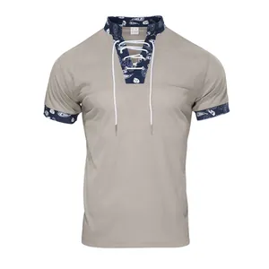 Close-up detail of grey corduroy Henry shirt with paisley trim and front lace-up design