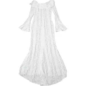 Elegant full-length view of white off-the-shoulder lace maxi dress with hollow-out design