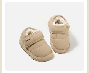 Detailed view of beige toddler snow boots featuring soft plush lining and secure velcro closure