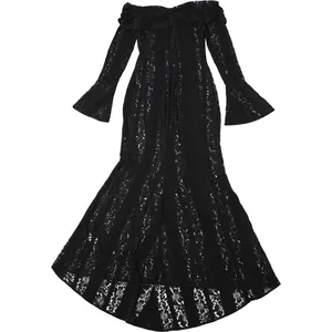 Close-up detail of off-the-shoulder black lace maxi dress with elegant flared long sleeves