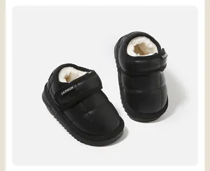 Detailed view of black baby snow boots with warm fleece lining and Velcro strap for winter