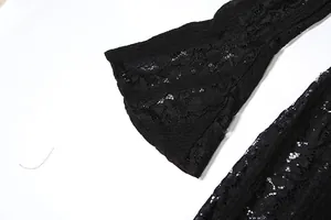 Detailed view of elegant black floral lace hollow out texture on flared dress sleeve