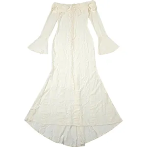 Close-up of white lace off-the-shoulder maxi dress with flared sleeves and mermaid hem