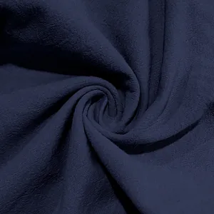 Close-up detail of navy blue linen fabric texture for casual men's straight-leg pants