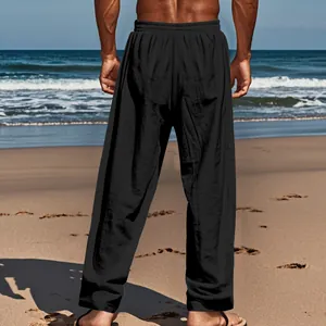 Detailed rear view showing the fit and texture of loose black linen pants for men