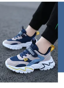 Close-up shot of breathable mesh sneakers for boys and girls on an asphalt surface