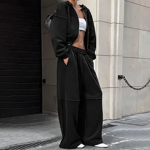Survêtement noir à la mode avec sweat à capuche zippé et pantalon large à taille haute
