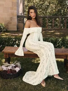 Elegant white lace off-the-shoulder long sleeve slim fit maxi dress in garden setting