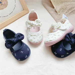 Floral canvas baby girl walking shoes with bow detail and soft sole, Japanese style.