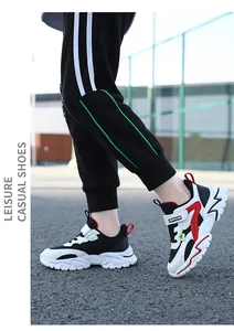 Detailed macro view of kids' breathable sports sneakers with secure velcro strap
