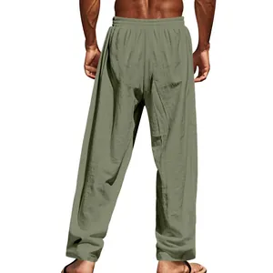 Back view of men's loose casual linen pants in solid olive green with elastic waist