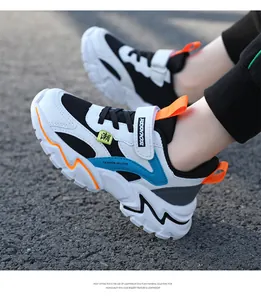 Side view of breathable mesh kids sneakers in blue and white with orange accents