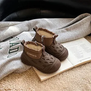 Detailed close-up of brown children's waterproof snow boots featuring warm faux fur lining