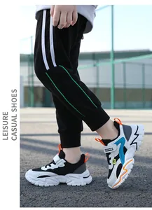 Detailed side view of breathable children's sneakers on model's feet