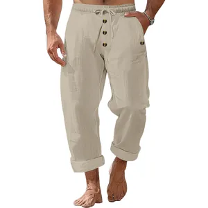 Detail view of khaki linen trousers for men with drawstring waist and button fly
