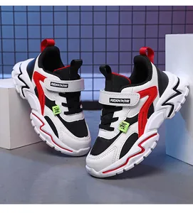 Side detail of children's breathable mesh sneakers with stylish red and black accents
