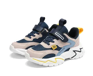 Detail of children's breathable mesh sneakers with Velcro straps and thick white sole