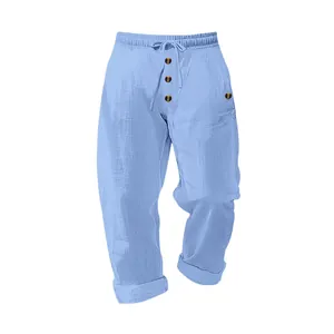 Detail of light blue linen-blend casual men's pants with drawstring and buttons