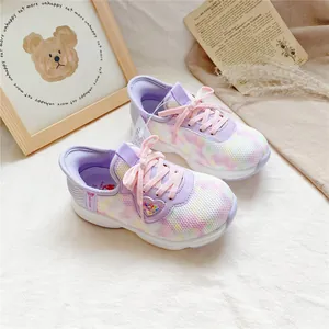 Close-up of breathable purple tie-dye mesh sneaker for kids featuring a glittery heart charm