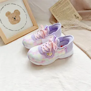 Detailed view of breathable children's tie-dye sneakers with cute heart sequin patch