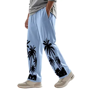 Detail view of men's light blue linen pants featuring a tropical black palm tree print