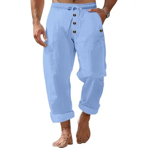 Men's loose linen drawstring pants in light blue with button fly detail