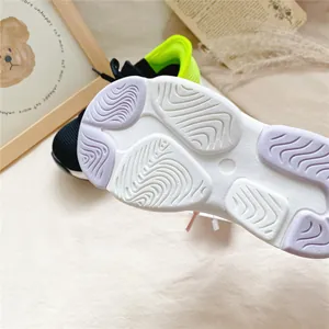 Macro view of durable non-slip outsole texture on children's breathable slip-on sneakers