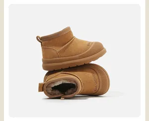 Close-up of chestnut baby snow boots with warm plush lining and anti-slip rubber soles