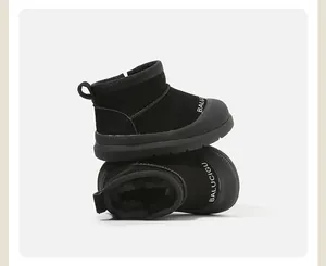 Close-up detail of black toddler snow boots with warm plush lining and BALUCIGU text