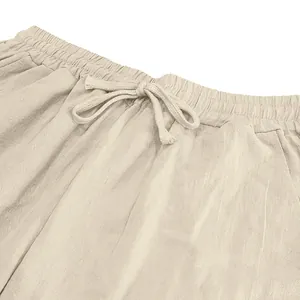 Close-up of elastic waistband and drawstring on men's linen casual beach pants.