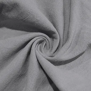 Macro view of breathable gray linen fabric texture for men's summer casual beach sets.