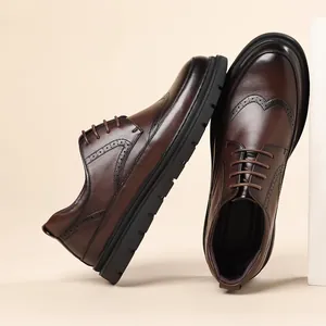 Men's brown leather brogue oxfords with classic wingtip detailing and thick soles