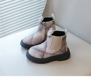 Detailed side view of children's denim pattern boots with zipper and elastic panel