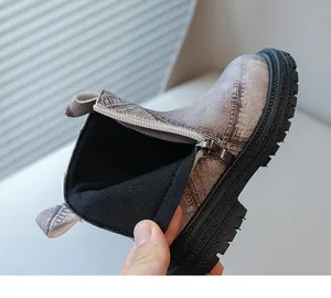 Close-up of the zipper and soft inner lining of these stylish children's Martin boots.