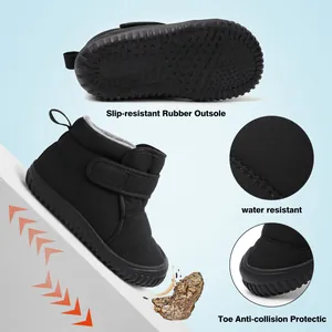 Detail of kids' black snow boots showing slip-resistant sole and water-resistant fabric