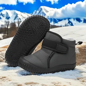 Grey children's snow boots with warm lining and non-slip rubber sole detail view