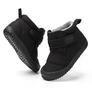 Detailed view of black toddler winter snow boots with warm fleece lining and rubber sole