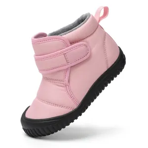 Pink kids winter snow boots with warm plush lining and non-slip rubber sole side view