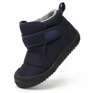 Detailed view of navy blue children's snow boot with warm fleece lining and velcro