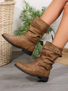 Chic brown slouchy mid-calf boots for women with decorative buckles and a low heel