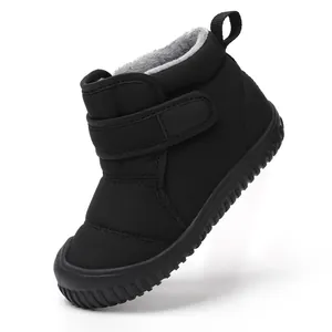 Black children's winter snow boots with warm plush lining and adjustable velcro strap.