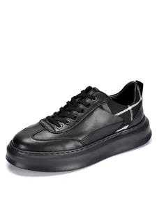 Close-up of black leather sneaker featuring a stylish checkered heel panel