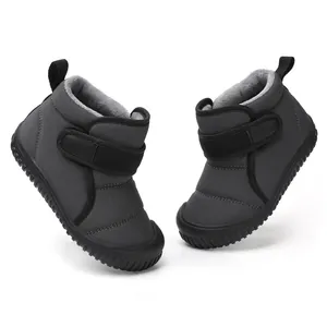Warm dark grey children winter snow boots with thick fleece lining and black velcro strap.