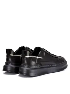 Rear view of men's black leather sneakers with thick sole and plaid pattern detail