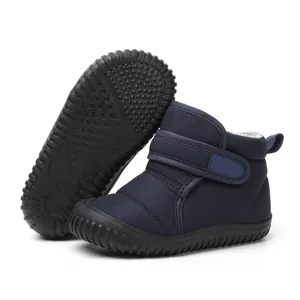 Detailed view of navy blue children's winter snow boots with anti-slip rubber sole