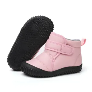 Detailed view of pink toddler snow boots with warm fleece lining and non-slip sole
