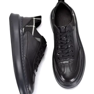 Men's black leather platform sneakers with lace-up design and plaid details