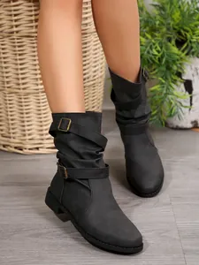 Stylish women's slouchy mid-calf boots featuring buckle straps and comfortable round toe