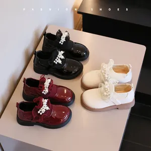 Close-up of girls' Japanese style Mary Jane shoes in multiple colors with pearl embellishments